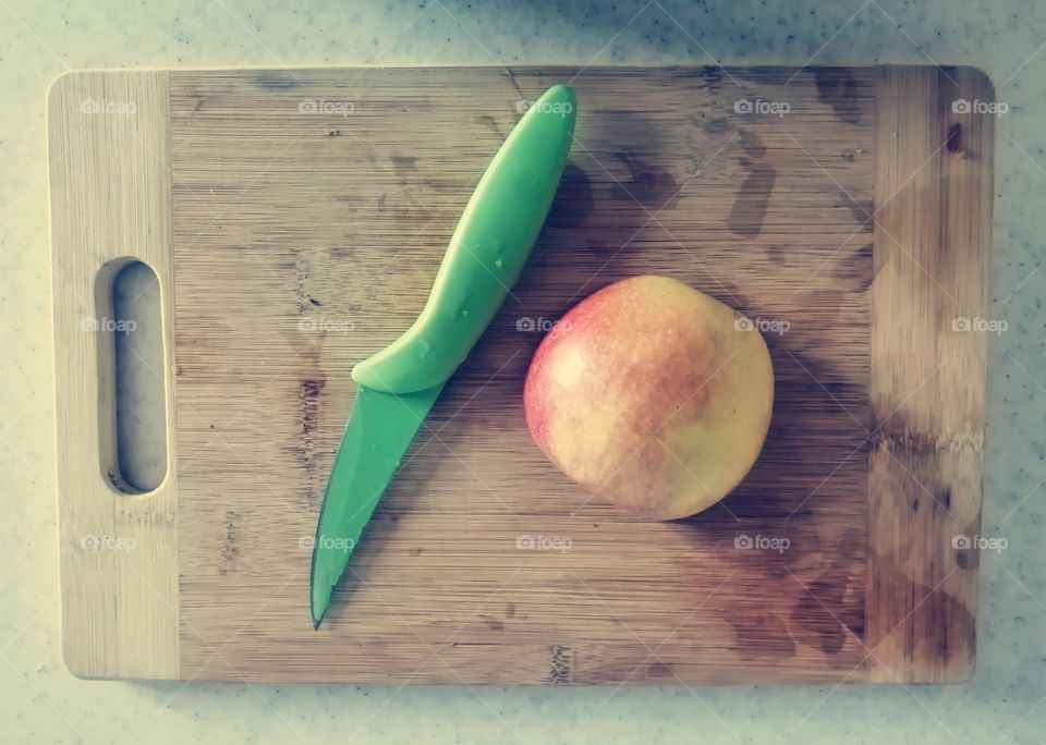 Food photo, apple, knife and board
