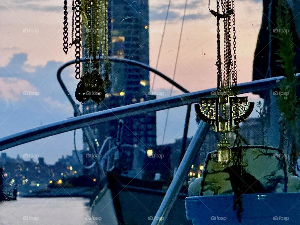 This is picturesque “Newtown Creek” by the “Pulaski Bridge” in LIC, Queens at twilight time seen from “Salvation”, our “28 foot 1969 Luhrs” cabin cruiser. The high rise across the “East River” is in “Greenpoint”, Brooklyn. 2024. Hypnotic Productions