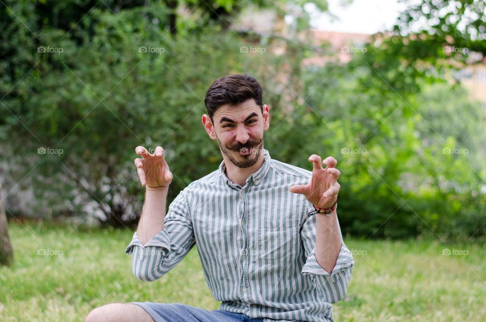 Funny Portrait of Young Man With Big Mustache