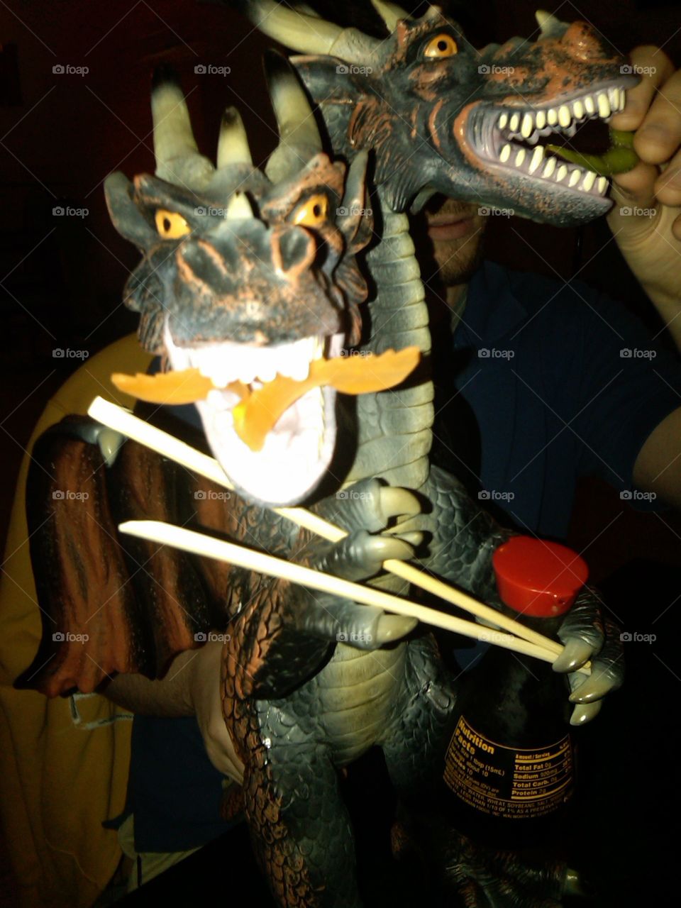 Two headed dragon holding Chopsticks and soy sauce