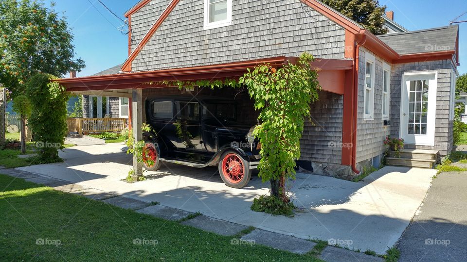 antique car in carport