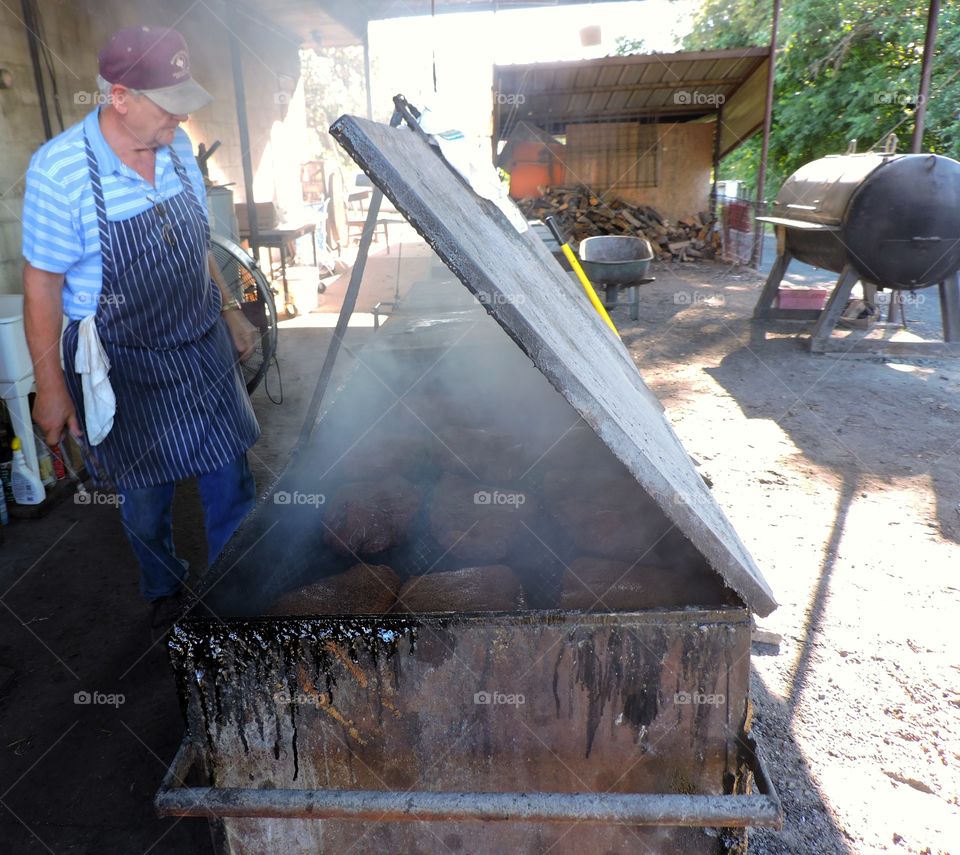 Pitmaster. Cooking bbq the old way. Outside everyday