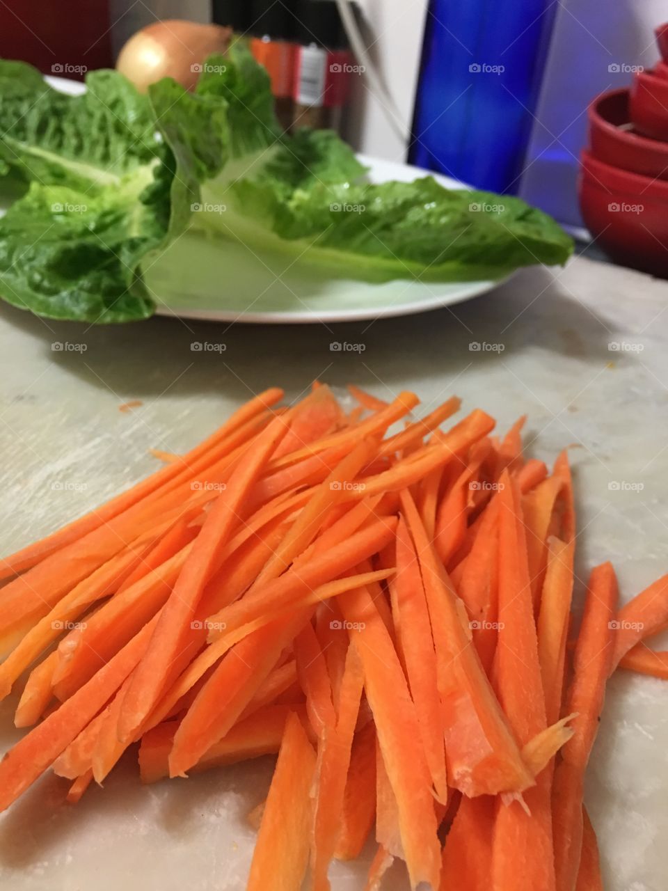 What's cooking? Prepping the carrots shown here carrot sticks on cutting board neatly arranged