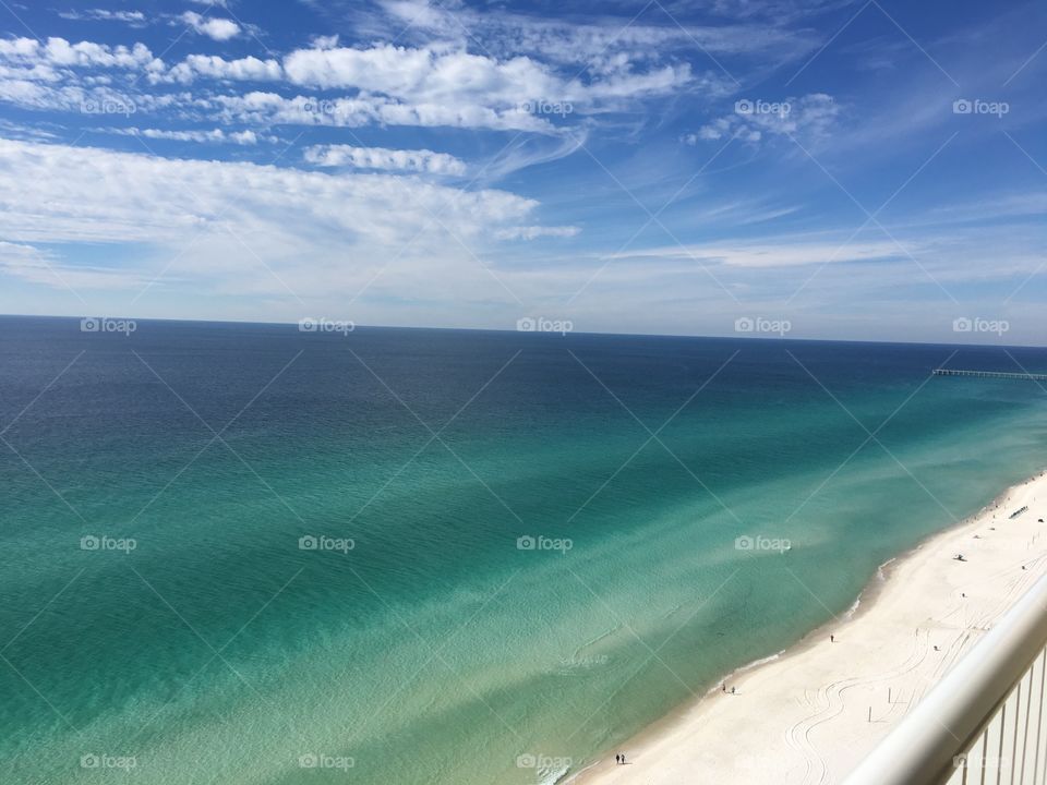 The view of the relaxing, calm, beautiful ocean water from a 12th floor balcony in Panama City Beach, FL. 
