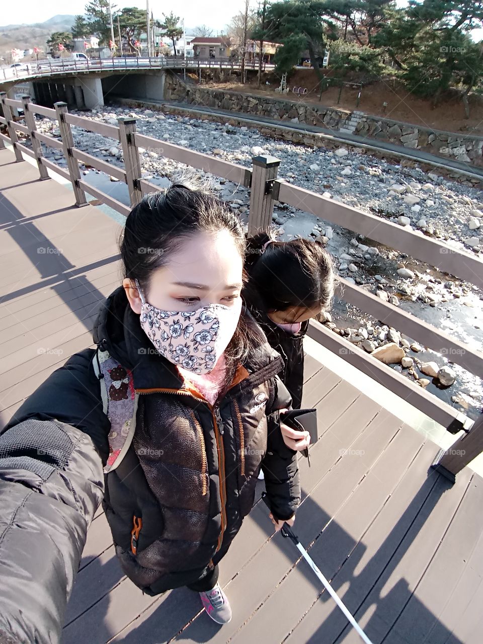 we are walking around just for one trip. to look for her favorate stones. we are now walking in the wood Bridge beside the river.