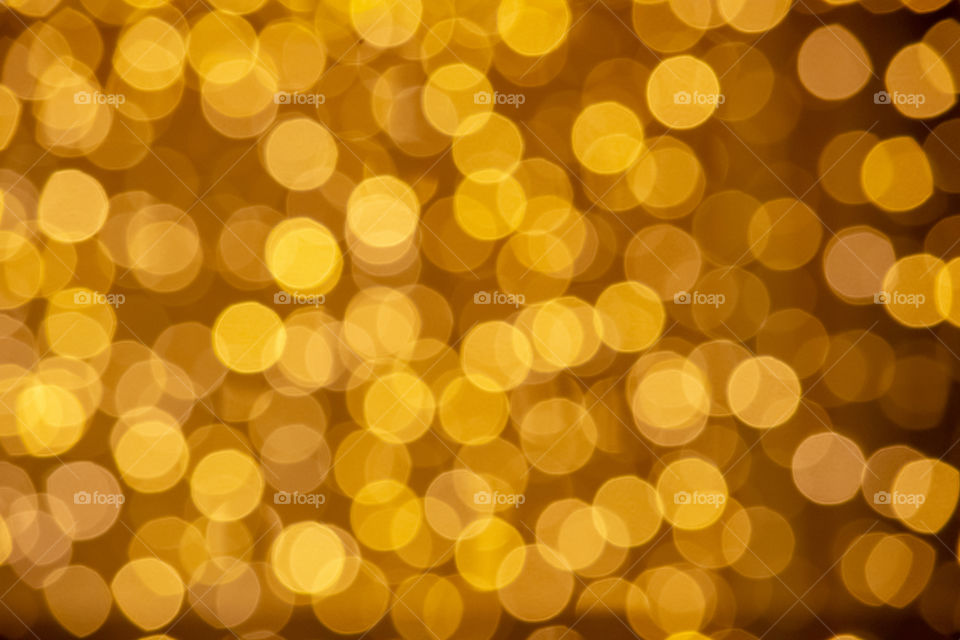 The blur of the bulb for decorative yellow gold, as the background.