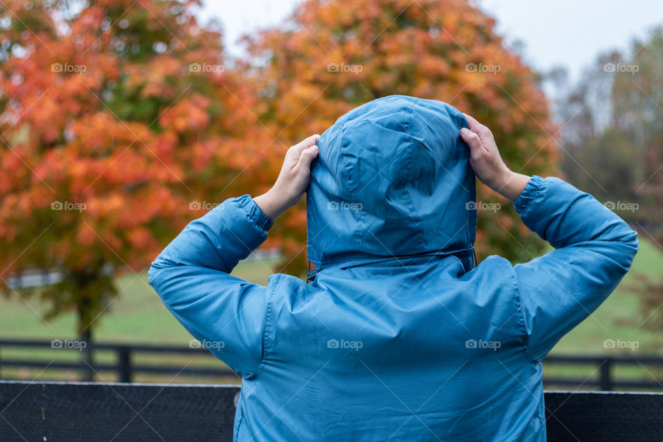 A woman enjoying a beautiful fall day