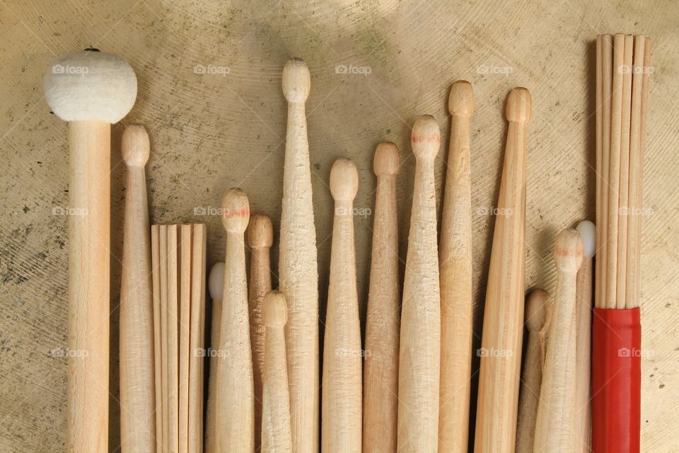 Various drumsticks on a cymbal