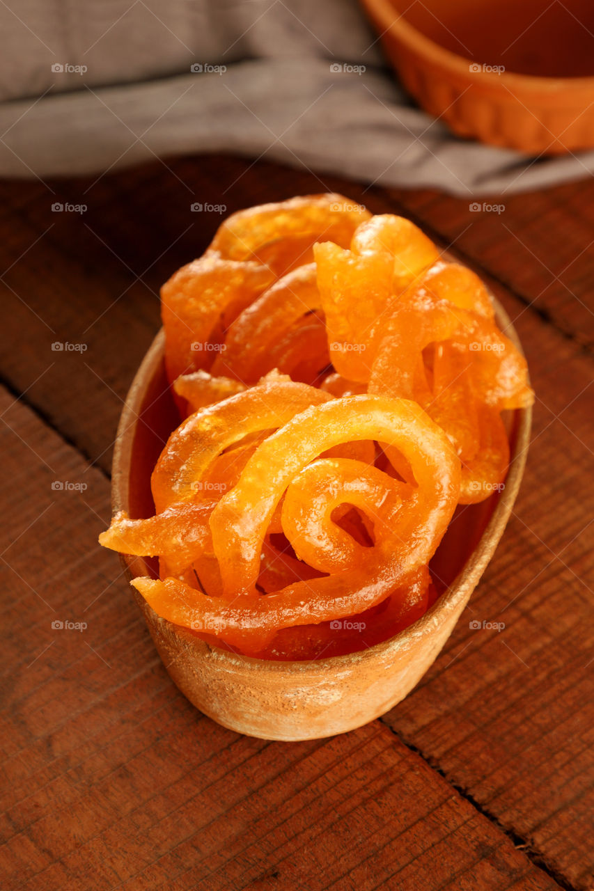 Indian sweet Jalebi in a pottery bowl