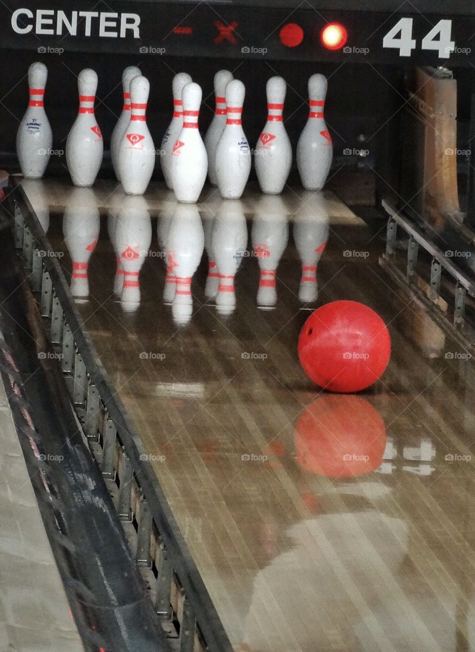 Bowling Ball Strike. Bowling Ball Going Down a Lane To Strike Pins
