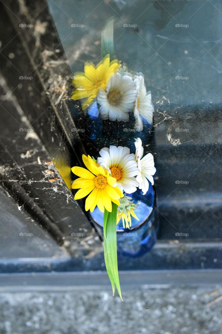 Flowers in a vase on the street