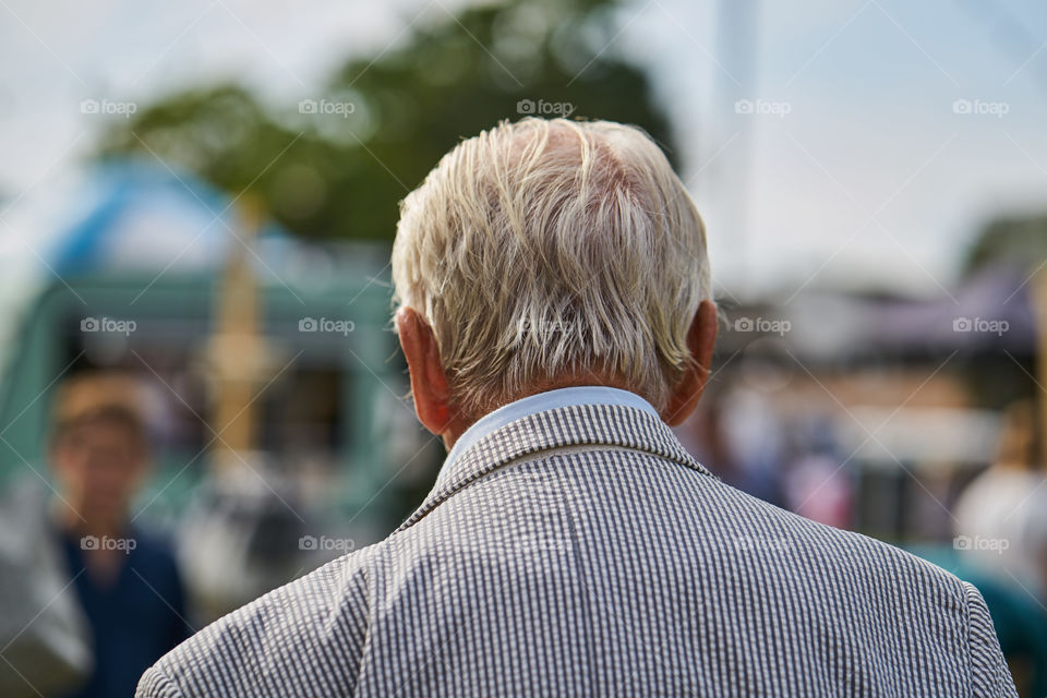 Close up portrait of an elderly man from behind