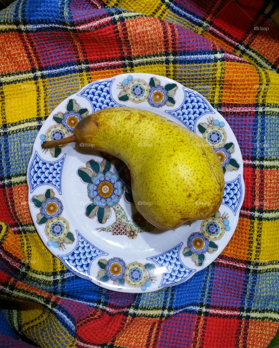 A pear on a plate