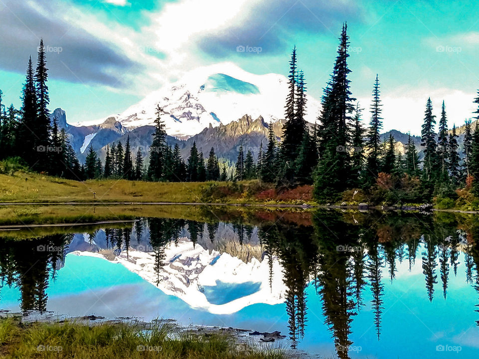 Reflection of volcanic mountain in water
