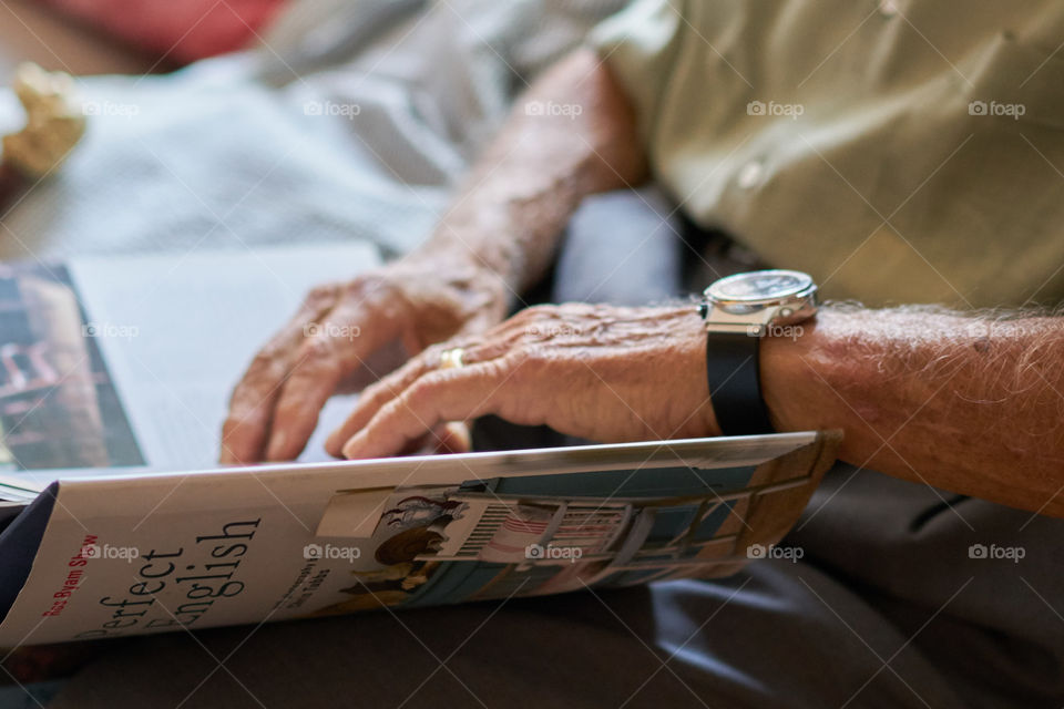 Aging Hands with a Book