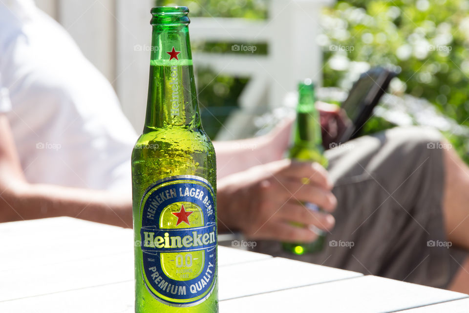 Having a cold Heineken on a sunny day 