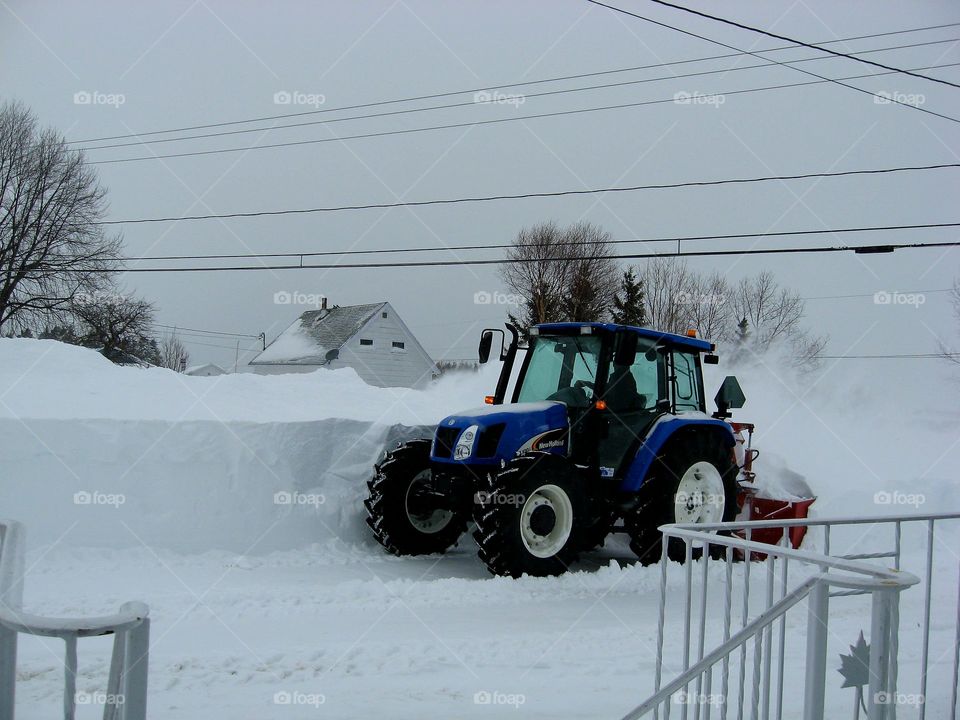tractor blowing snow