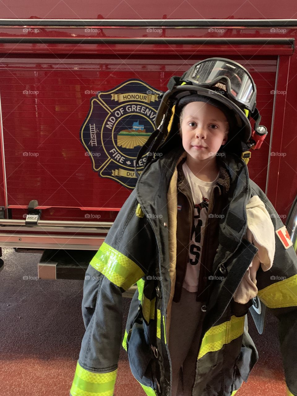 Little boy in firefighter turnout gear 