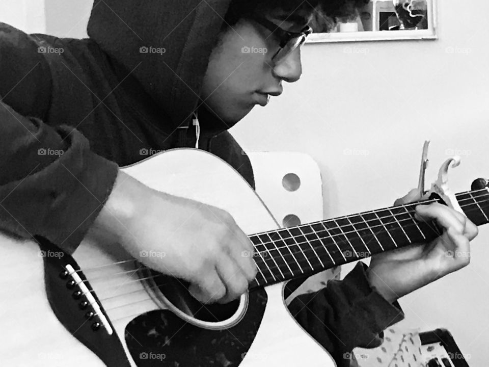 A young man and his guitar.