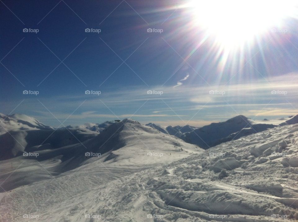 Snow covered sunny mountains