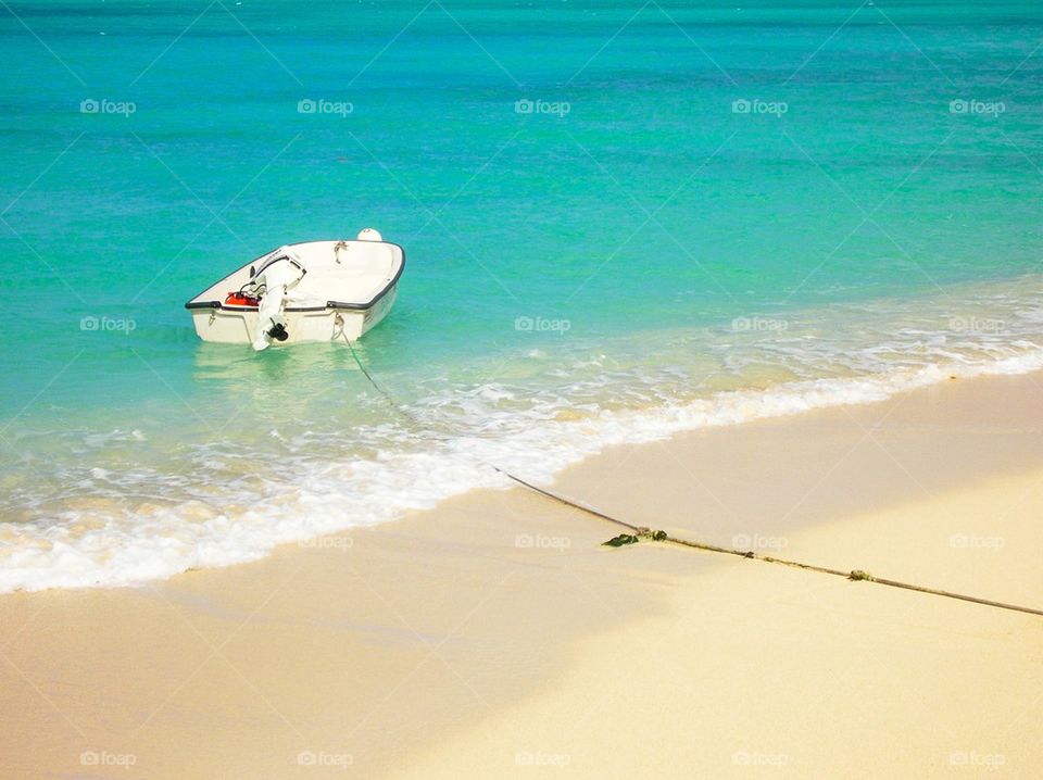 View of boat moored at Jamaican beach