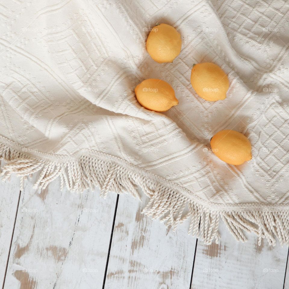 Yellow lemon on the bed