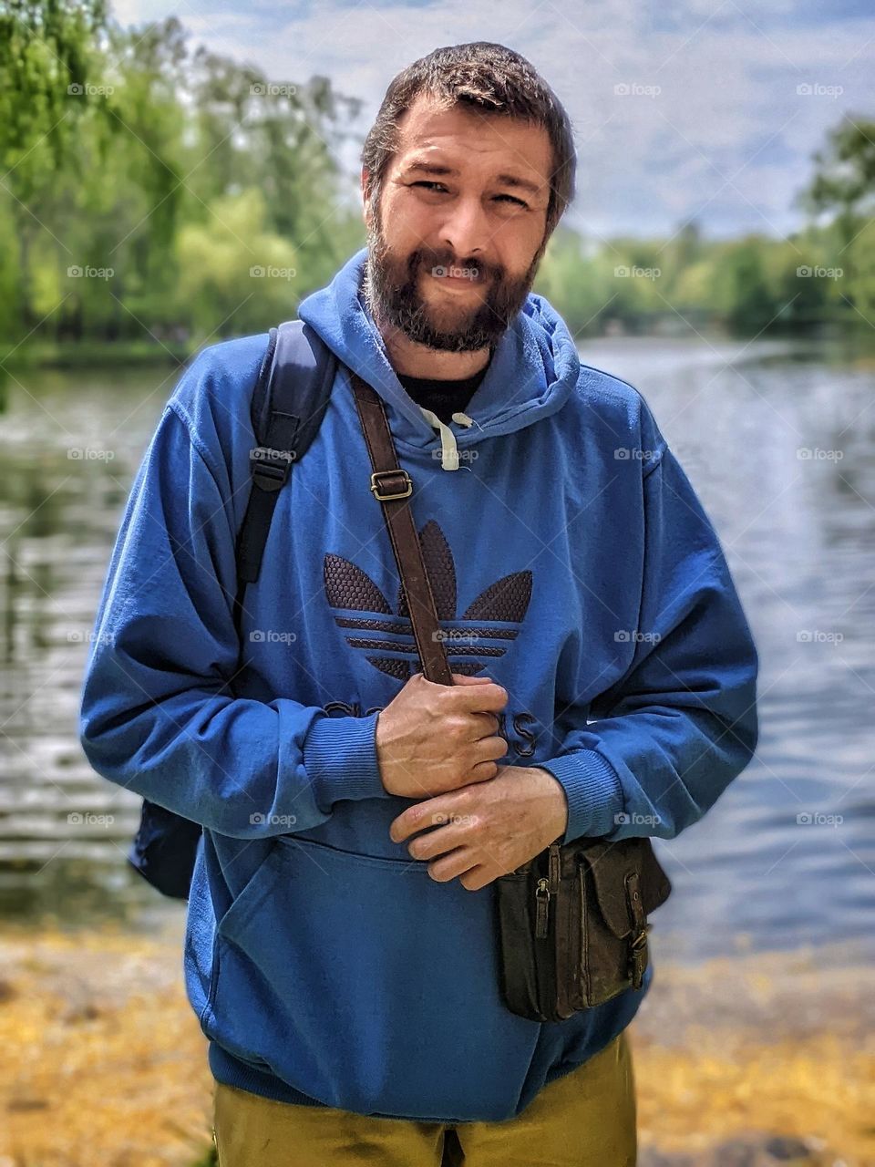 portrait of a man with a beard on a blurred background of nature