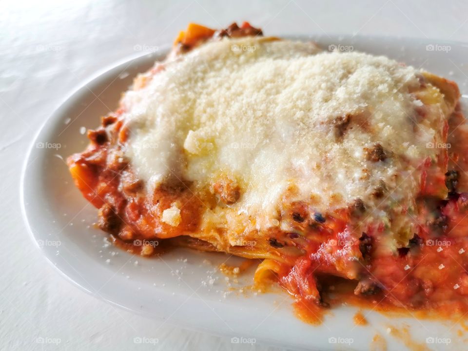 Lasagna Bolognese with parmesan cheese.