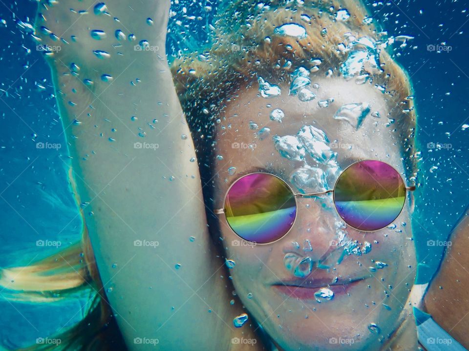 a selfie under the water on a summer day