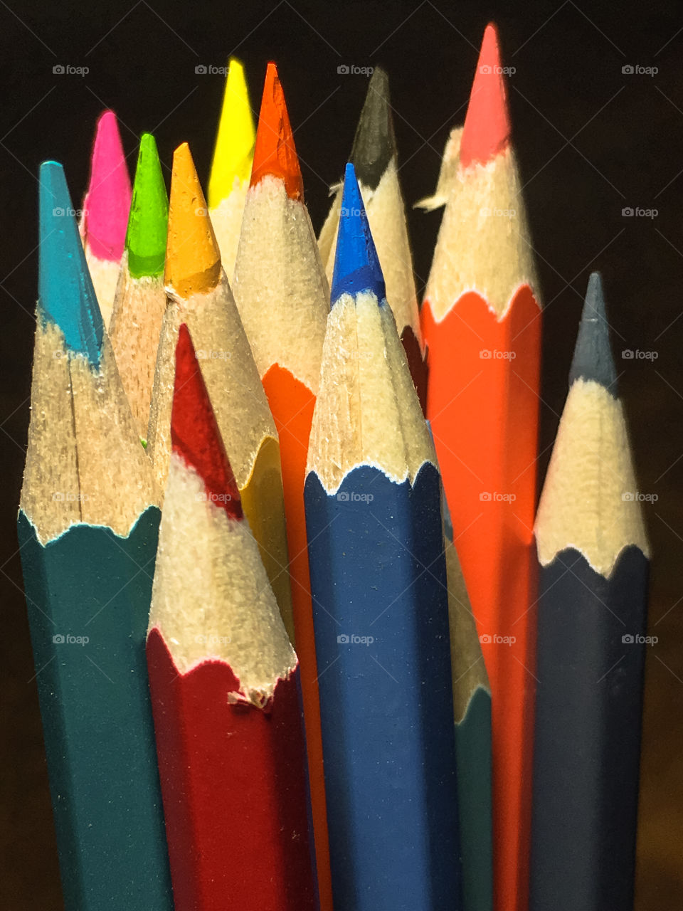 Close up view of a group of colored pencils.