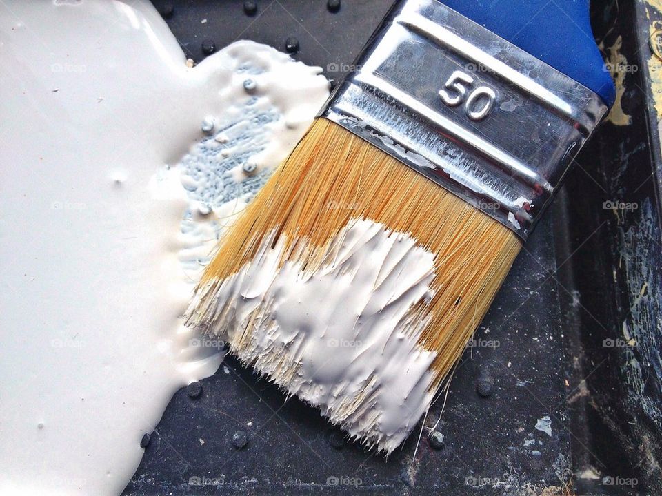 A loaded paintbrush. 