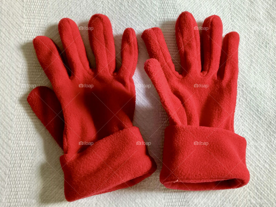 Red winter gloves in a white background. Protection for cold weather. Season. winter.