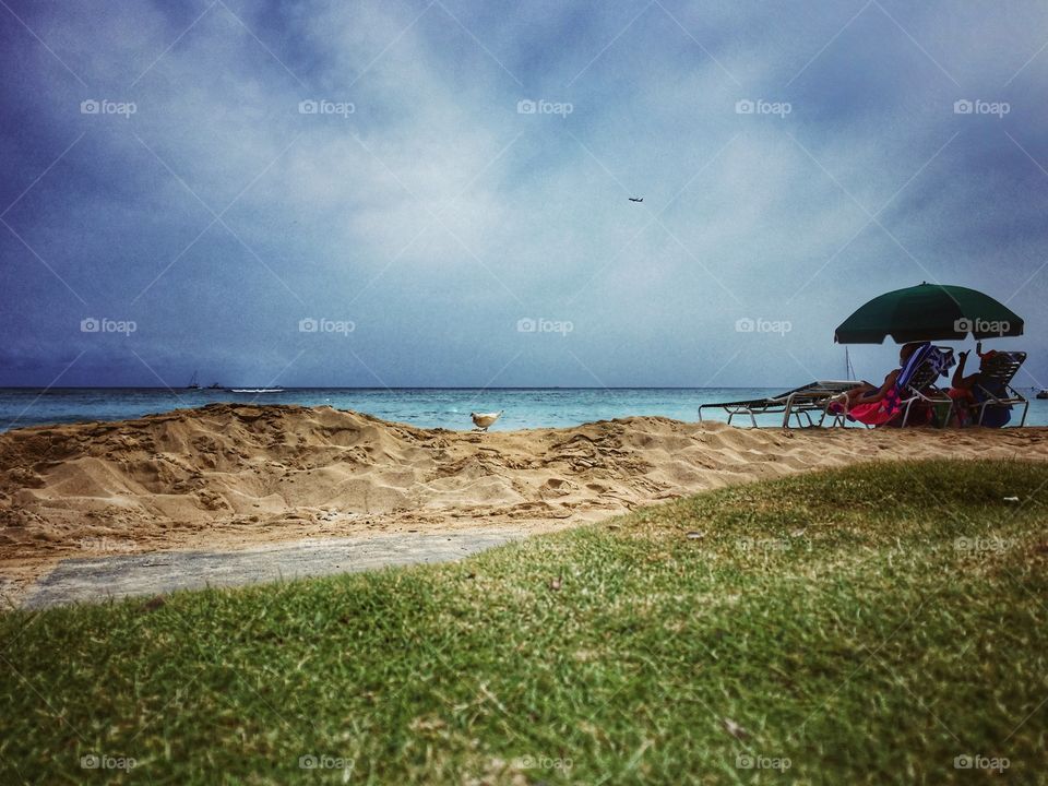 Sitting on a lonely stretch of beach 