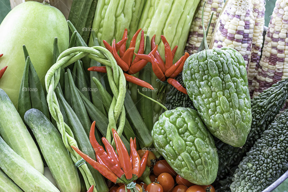 Vegetables in Thailand Cucumber , Tomato , Bitter gourd and red chilli.