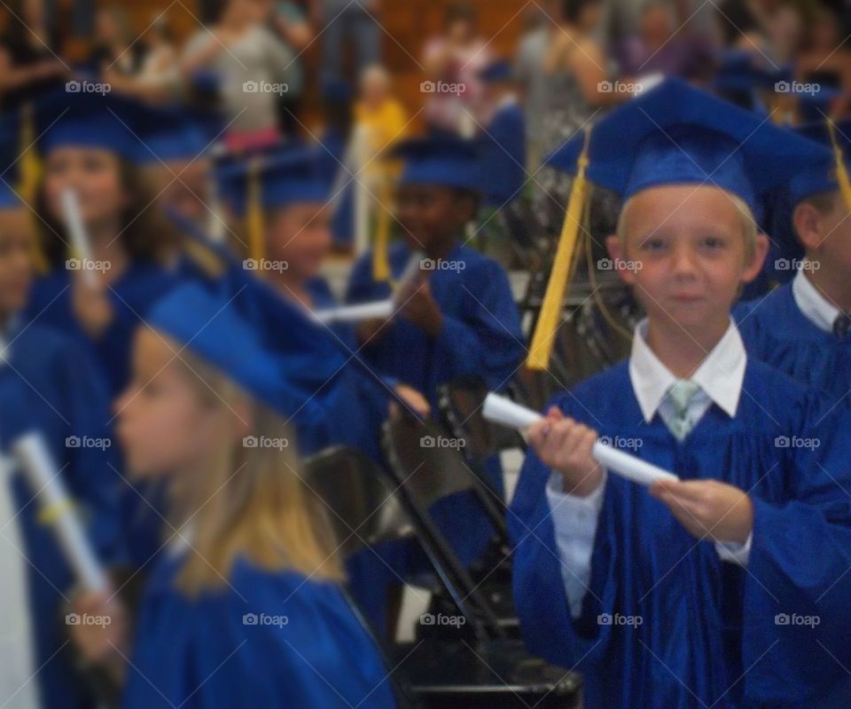 Students wearing graduation gown