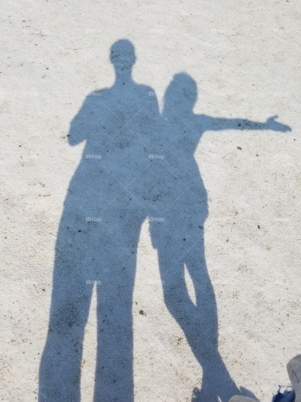 man and woman couple siholette in the salt lake of Sereflikochisar Turkey