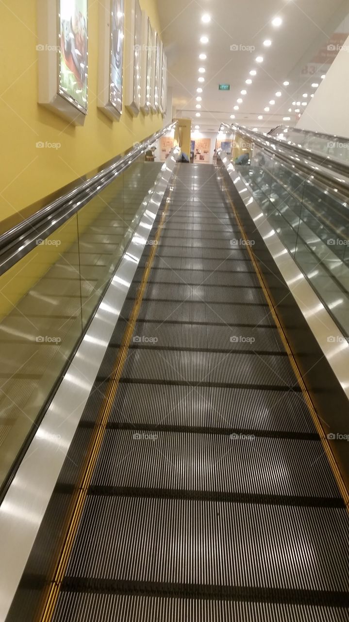 Ride up!. glimmering escalators 