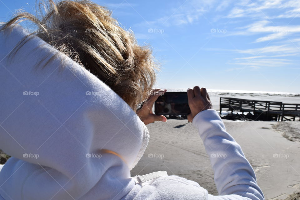 Close-up of woman photographing with camera