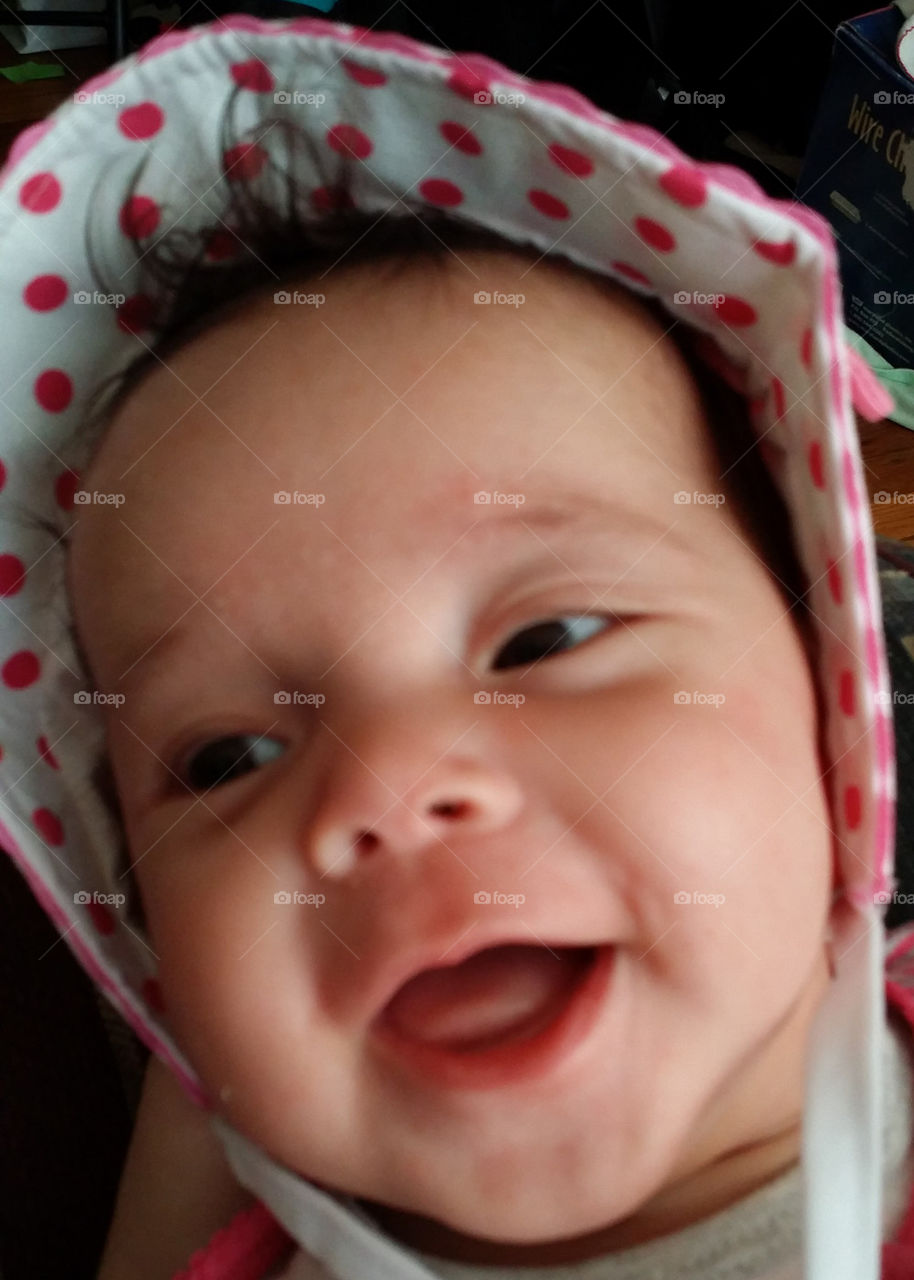 happy baby in a bonnet