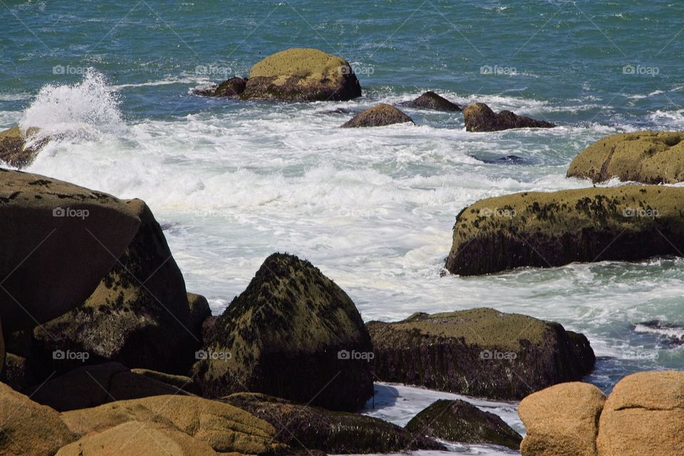 waves crashing on rocks