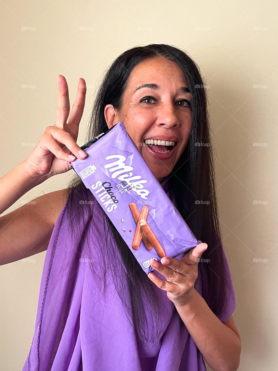 Energetic, Light-Hearted Portrait of Beautiful Smiling Woman with Milka Chocolate Sticks