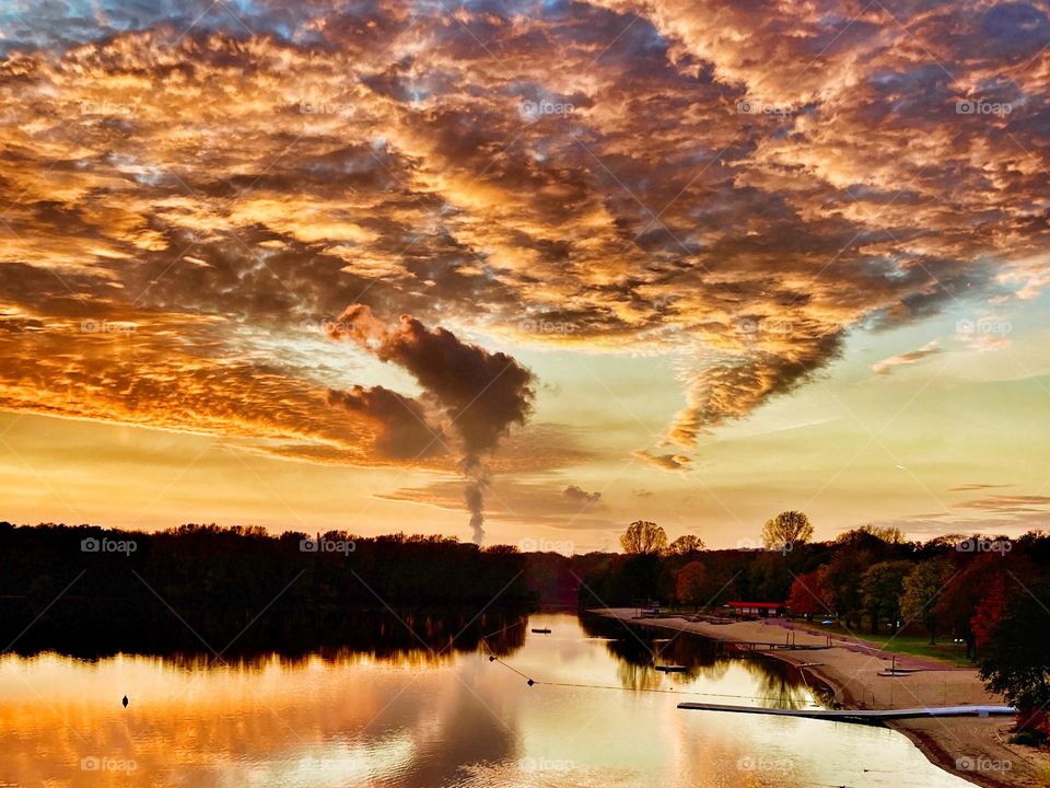Cloudy sky at sunset over the lake
