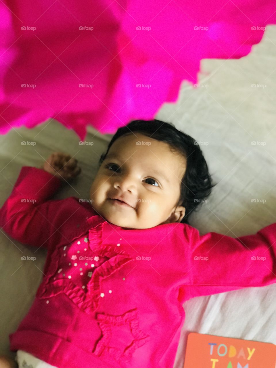 Cute pink baby enjoying the day, and baby in pink dress.