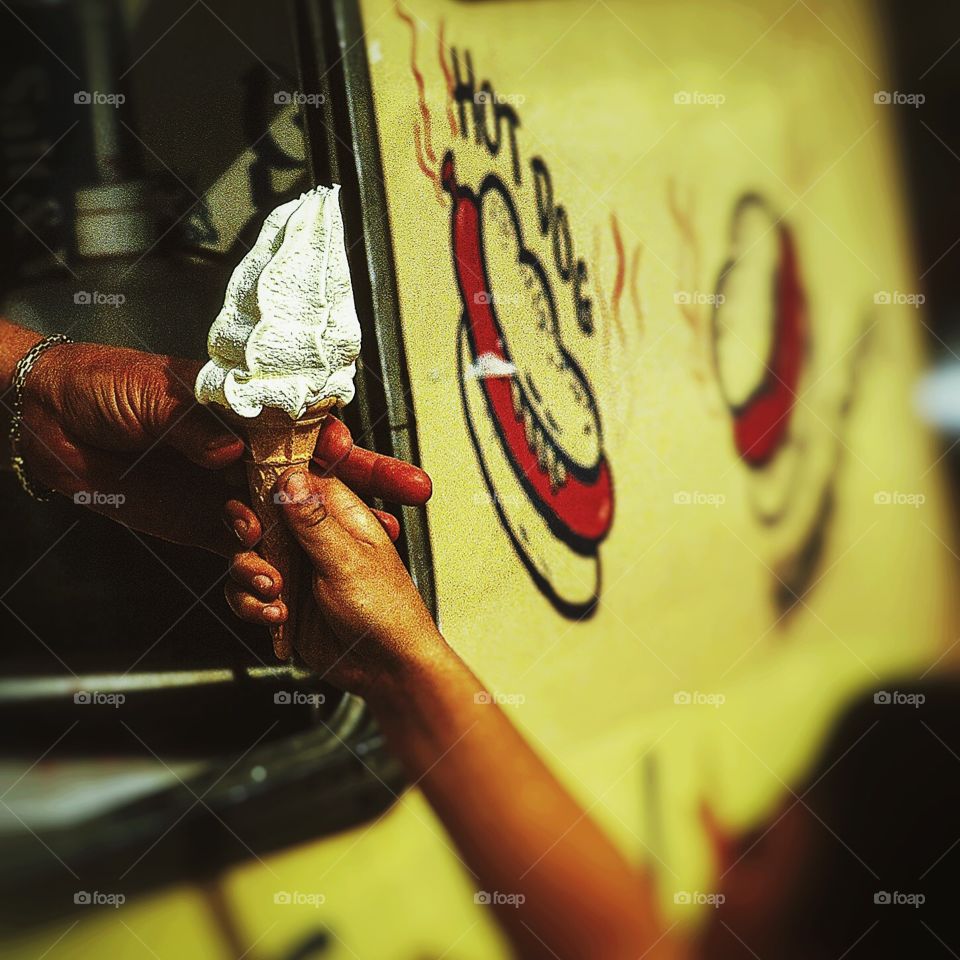 Ice cream . Boy buying ice cream cornet from van 