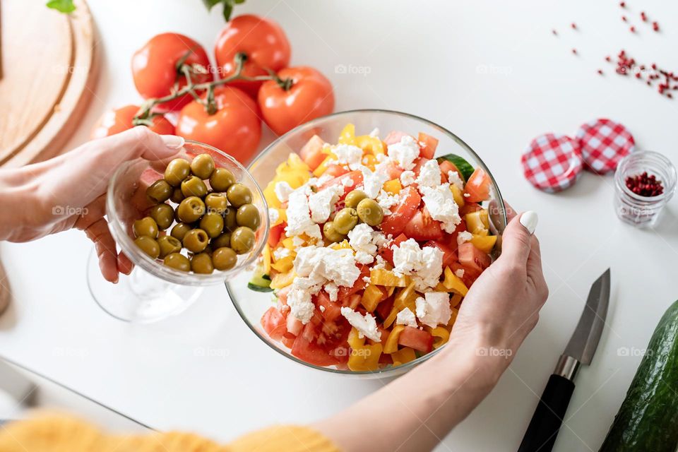 woman making salad