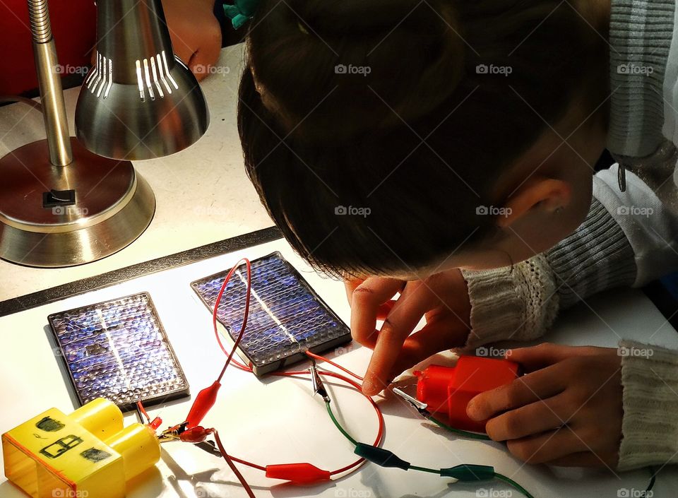 Boy Making An Electric Circuit. Young Student Building An Electrical Circuit In Science Classroom
