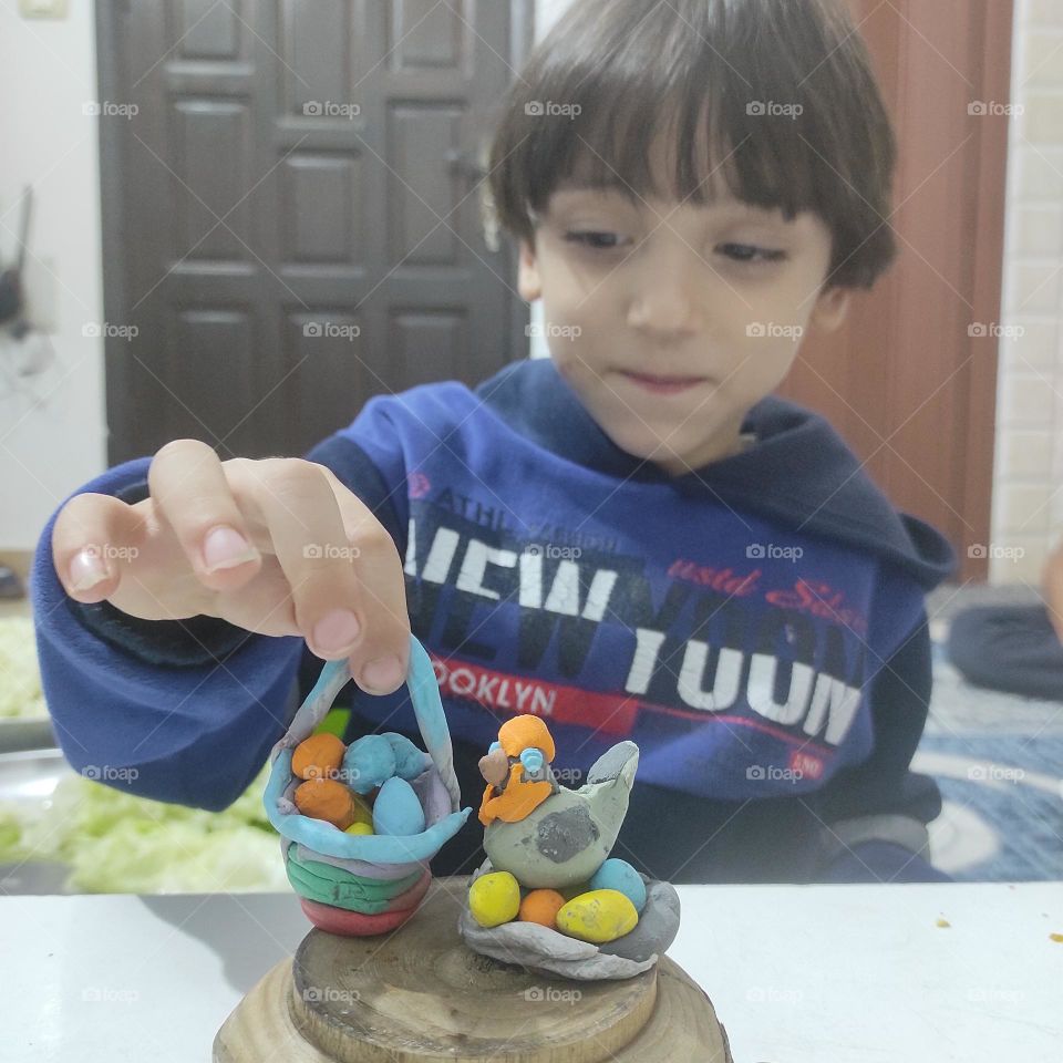 This child is talented in shaping figures with clay
