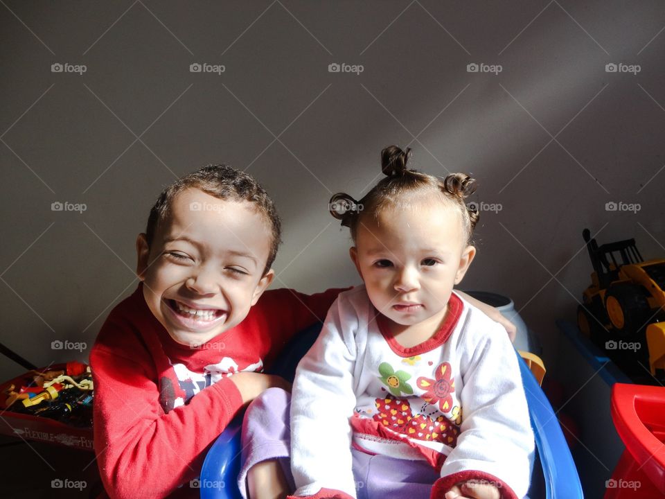 Portrait of brother and sister at home