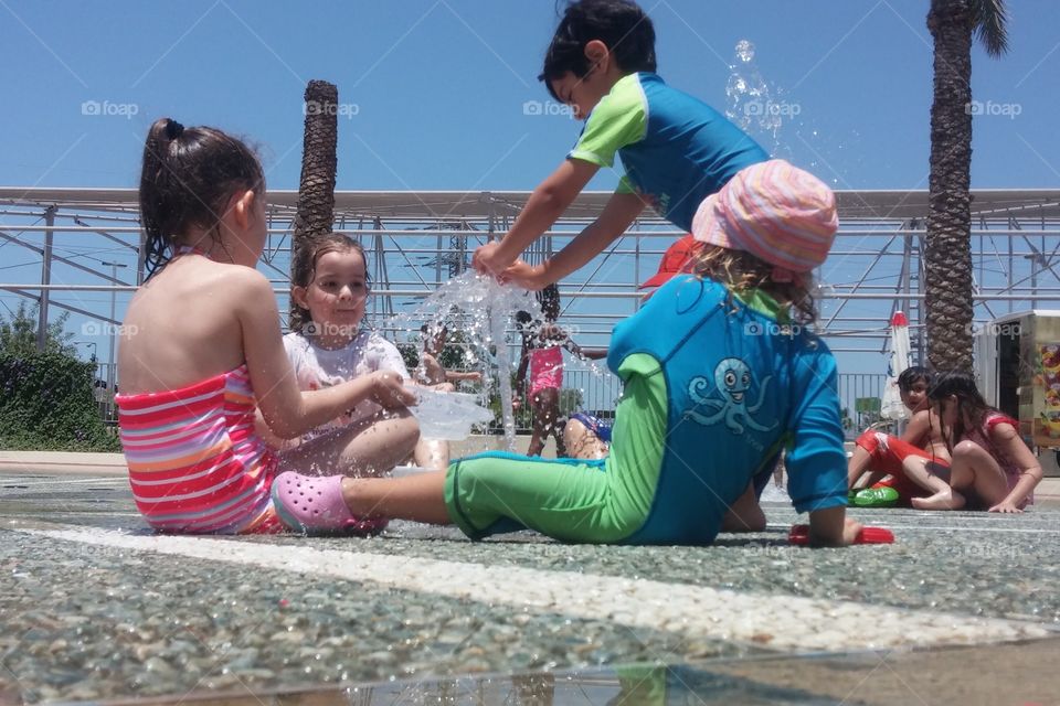 Kids. Kids playing with fountain 