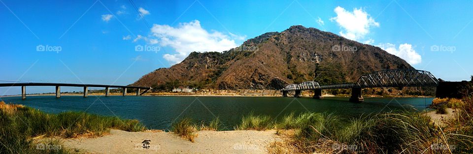 bridges. the old and a new bridge parallel at each other.